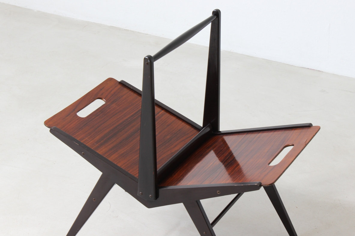 Elegant magazine rack in dark wood.  Italian manufacture, 1950's.