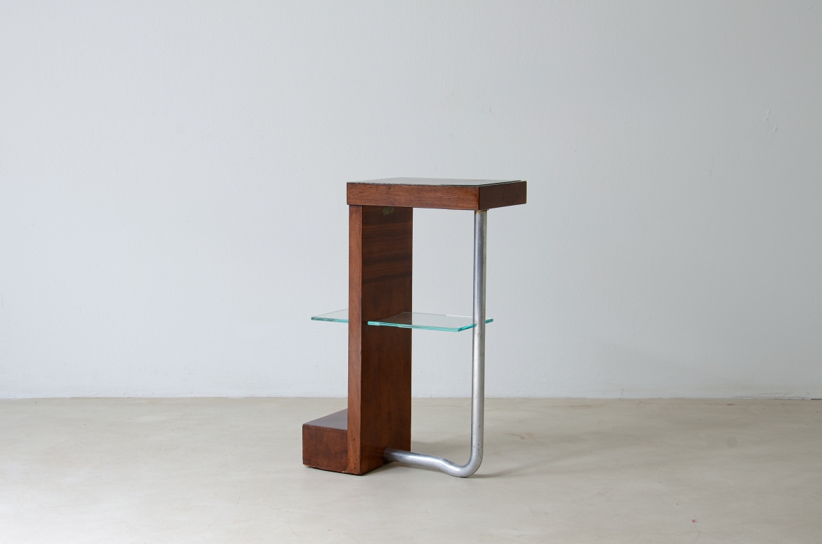 Armando Melis de Villa  Side table in polished wood with curved metal leg.  Designed for the Royal insurance company of Turin.  Italian manufacture, 1930's.