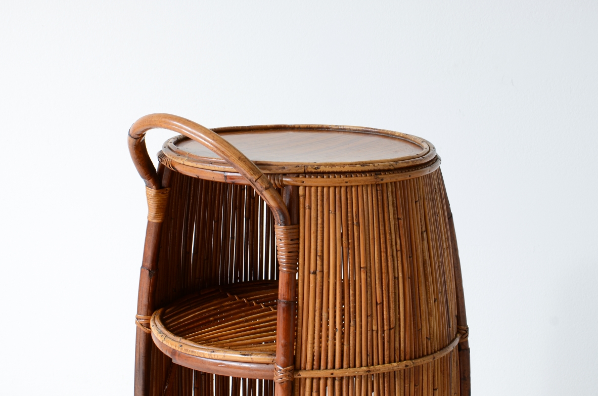 Bar cabinet in rattan and woven staraw, wooden top and compartments for bottles and glasses.  Italian manufacture, around 1950.