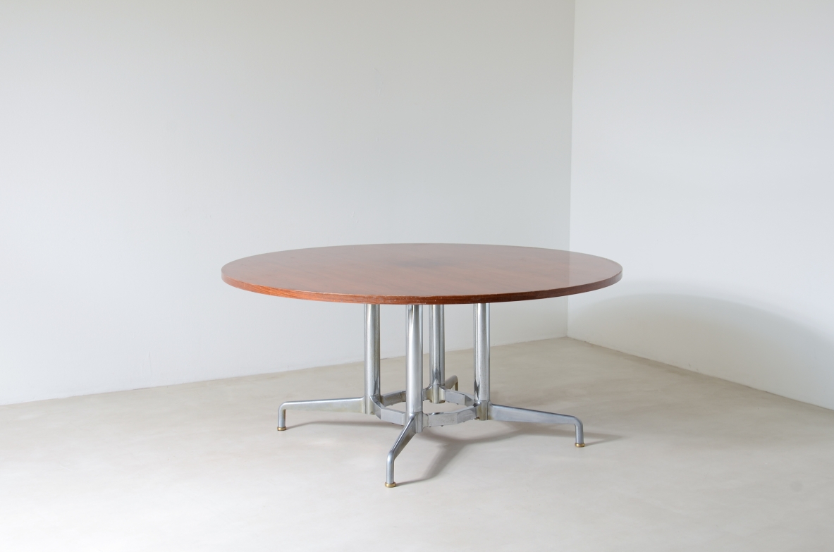 Italian 1960's dining table with nice polished metal base and wooden top.