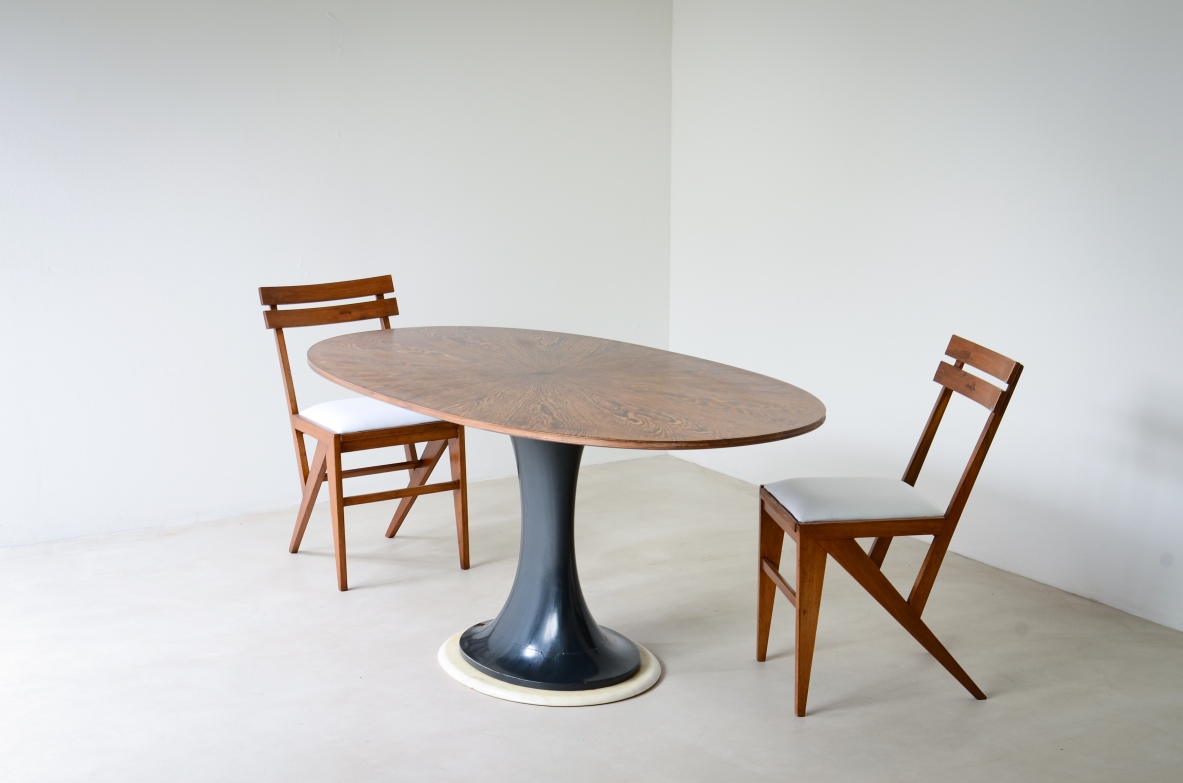 Elegant oval table with turned base in petrol blue lacquered wood and marble disc.  Palm wood veneer top.  Turin School, 1960's.