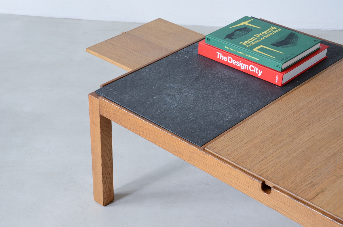 Low table with wooden and slate top, one compartment under the central wooden top and two side shelves.  Italian manufacture around 1960s.