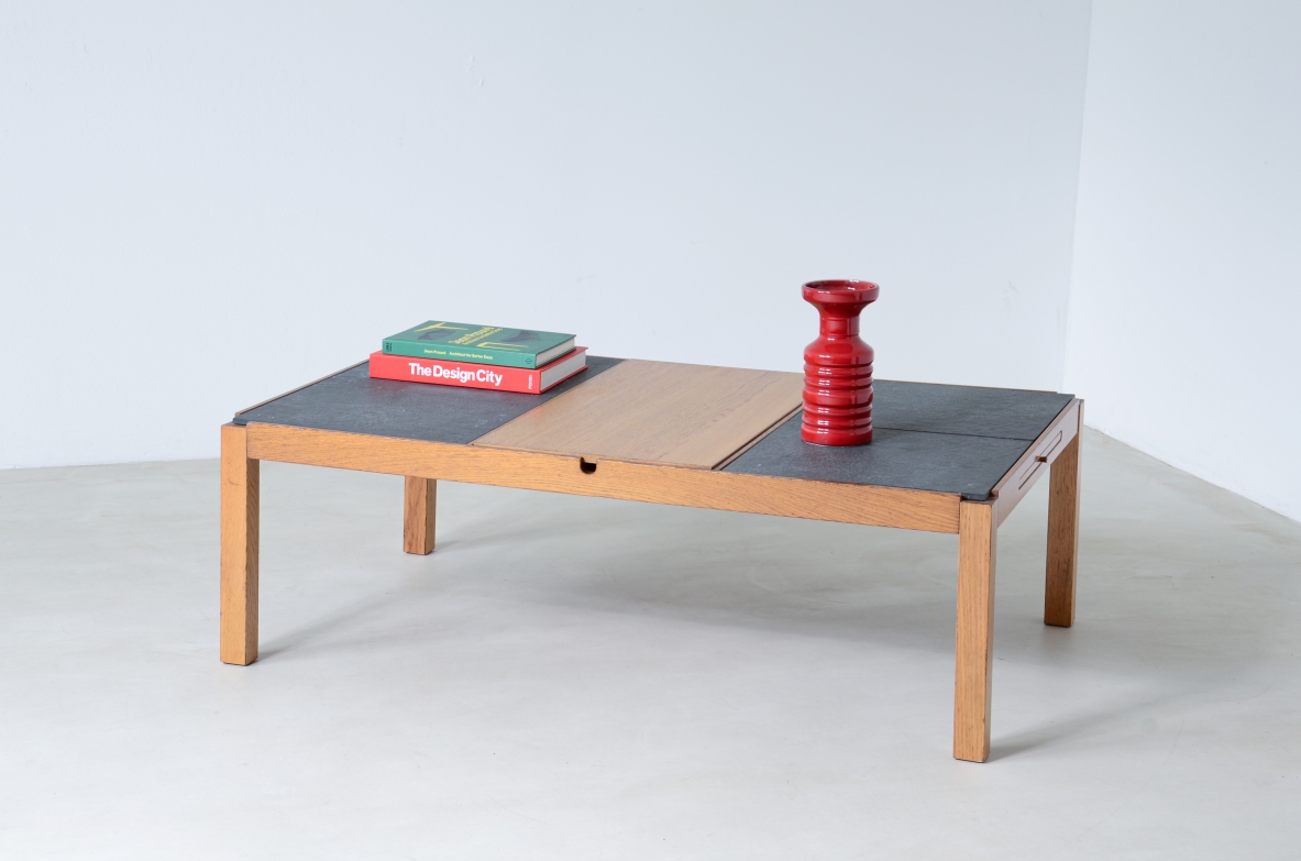 Low table with wooden and slate top, one compartment under the central wooden top and two side shelves.  Italian manufacture around 1960s.
