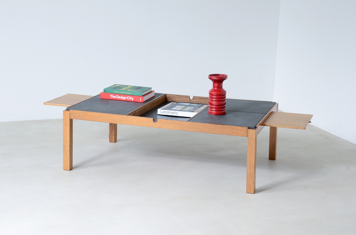 Low table with wooden and slate top, one compartment under the central wooden top and two side shelves.  Italian manufacture around 1960s.