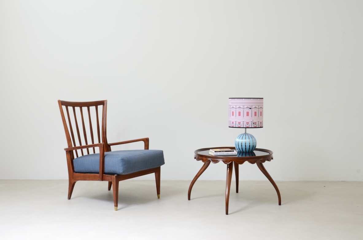 Table lamp with original 1950s ceramic base and fabric cap printed in the style of Piero Fornasetti.