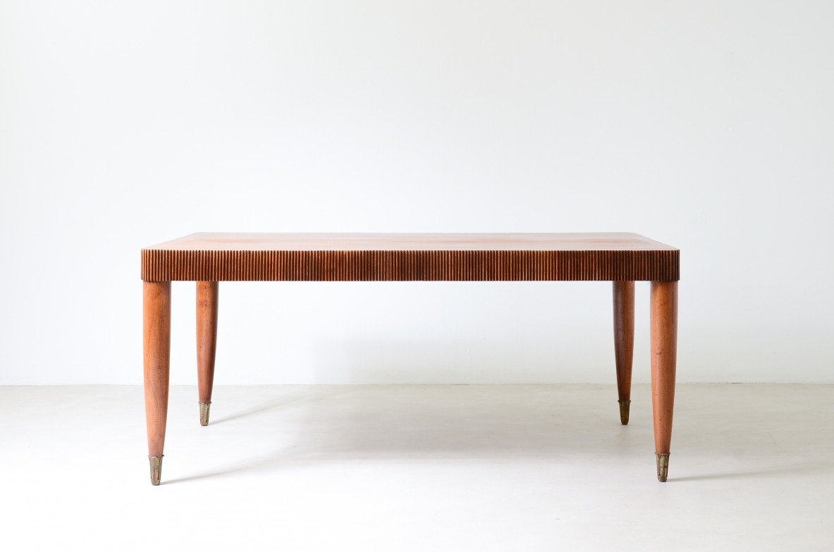 Elegant table with band motif in grissinato wood, top in walnut wood, turned legs with carved wooden tips.  Italian manufacture approx. 1940's.