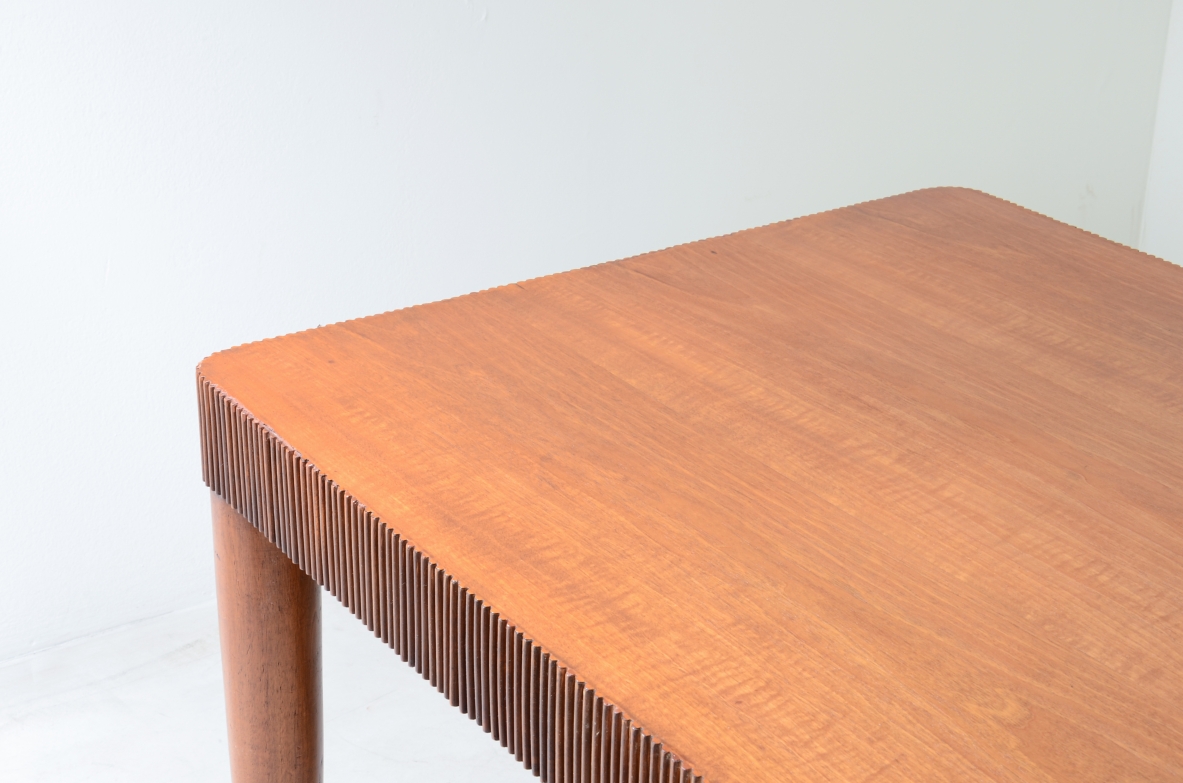 Elegant table with band motif in grissinato wood, top in walnut wood, turned legs with carved wooden tips.  Italian manufacture approx. 1940's.