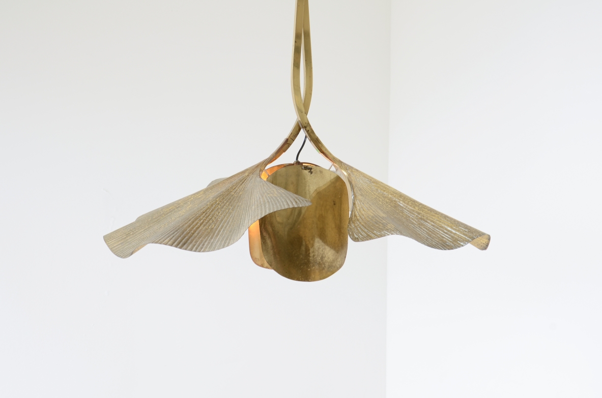 Tommaso Barbi  Large pendant chandelier made by the renowned artist and designer in the shape of a flower composed of 2 large brass ginko leaves and intertwined branches.  Italian manufacture from the 70's
