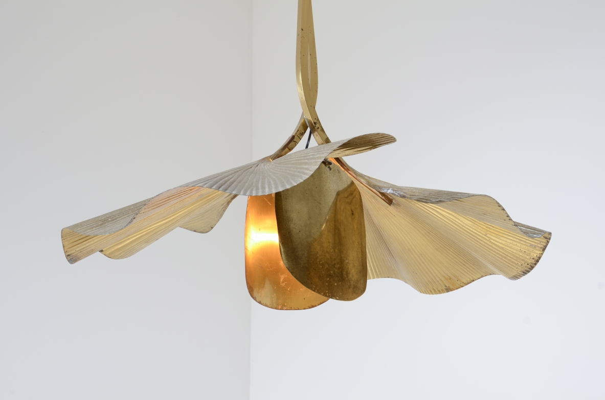 Tommaso Barbi  Large pendant chandelier made by the renowned artist and designer in the shape of a flower composed of 2 large brass ginko leaves and intertwined branches.  Italian manufacture from the 70's