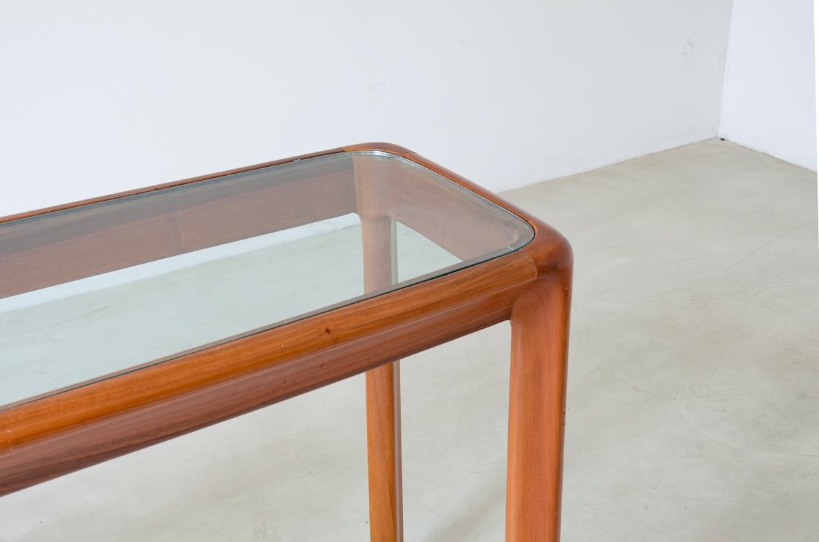 Angelo Mangiarotti (1921-2012)  Tavolo console con struttura in legno e piano in cristallo molato di forte spessore.