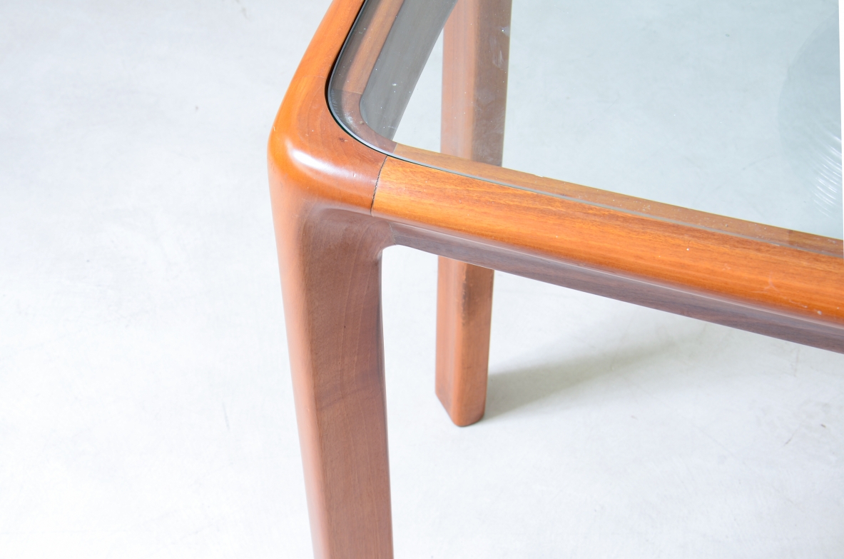 Angelo Mangiarotti (1921-2012)  Tavolo console con struttura in legno e piano in cristallo molato di forte spessore.