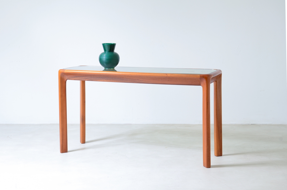 Angelo Mangiarotti (1921-2012)  Tavolo console con struttura in legno e piano in cristallo molato di forte spessore.