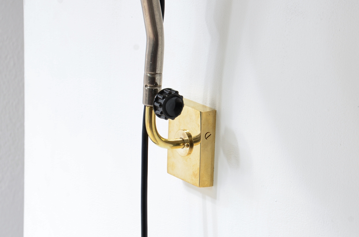 Pair of Bakelite lamps with adjustable metal arm and brass wall plate.  Germany 1930s.