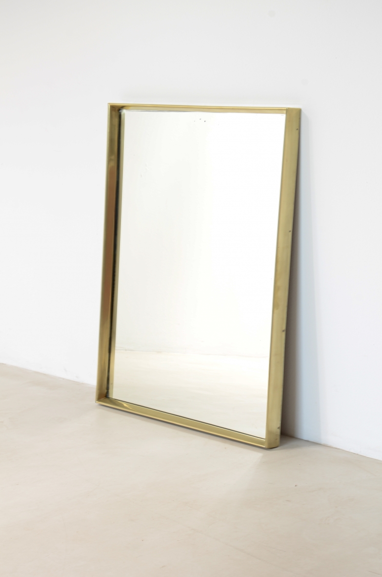 Shaped brass mirror.  Italian manufacture, ca. 1960.