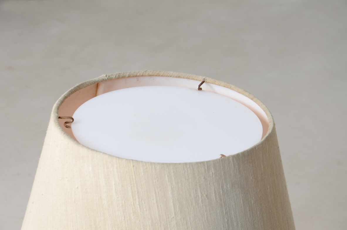 Pair of colored glass lamps with brass detail and fabric shade with perplexed disc.