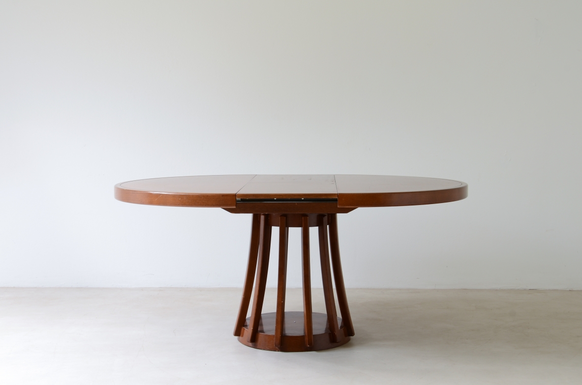 Angelo Mangiarotti Extendable walnut table, designed in 1972. Round pedestal. La Sorgente Furniture production,1972.