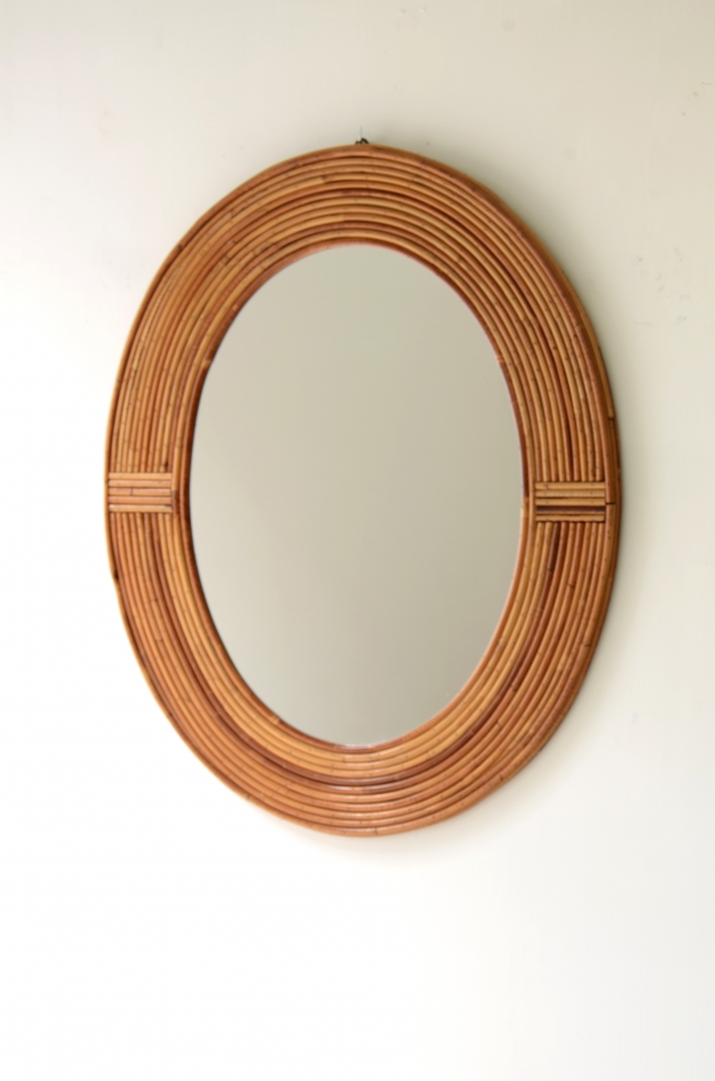 Vivai del Sud  Oval shaped tropical rattan mirror.