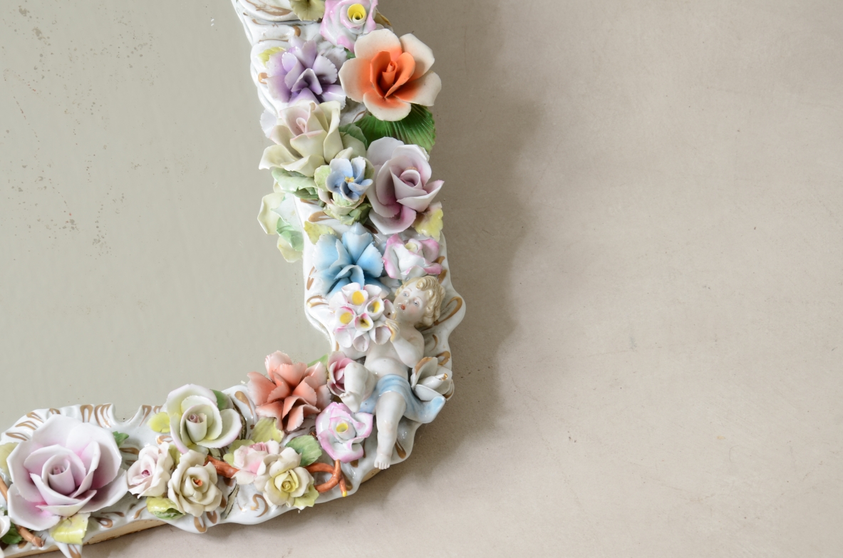 Mirror with important polychrome flower porcelain frame. Capodimonte manufacture