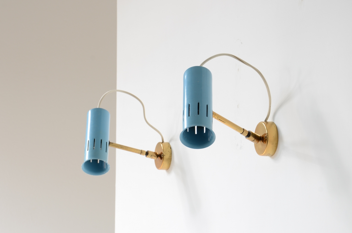 Pair of adjustable spotlights in all directions in lacquered metal and brass.1950