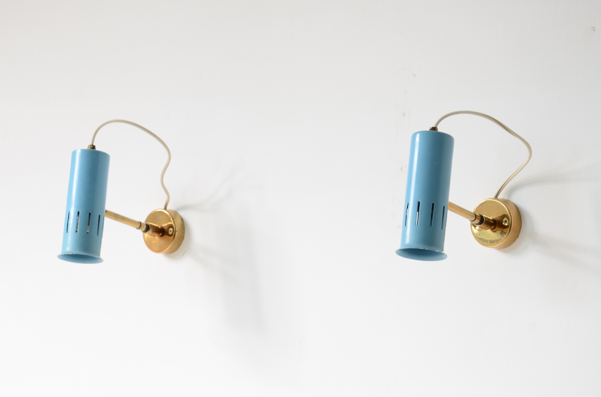 Pair of adjustable spotlights in all directions in lacquered metal and brass.1950