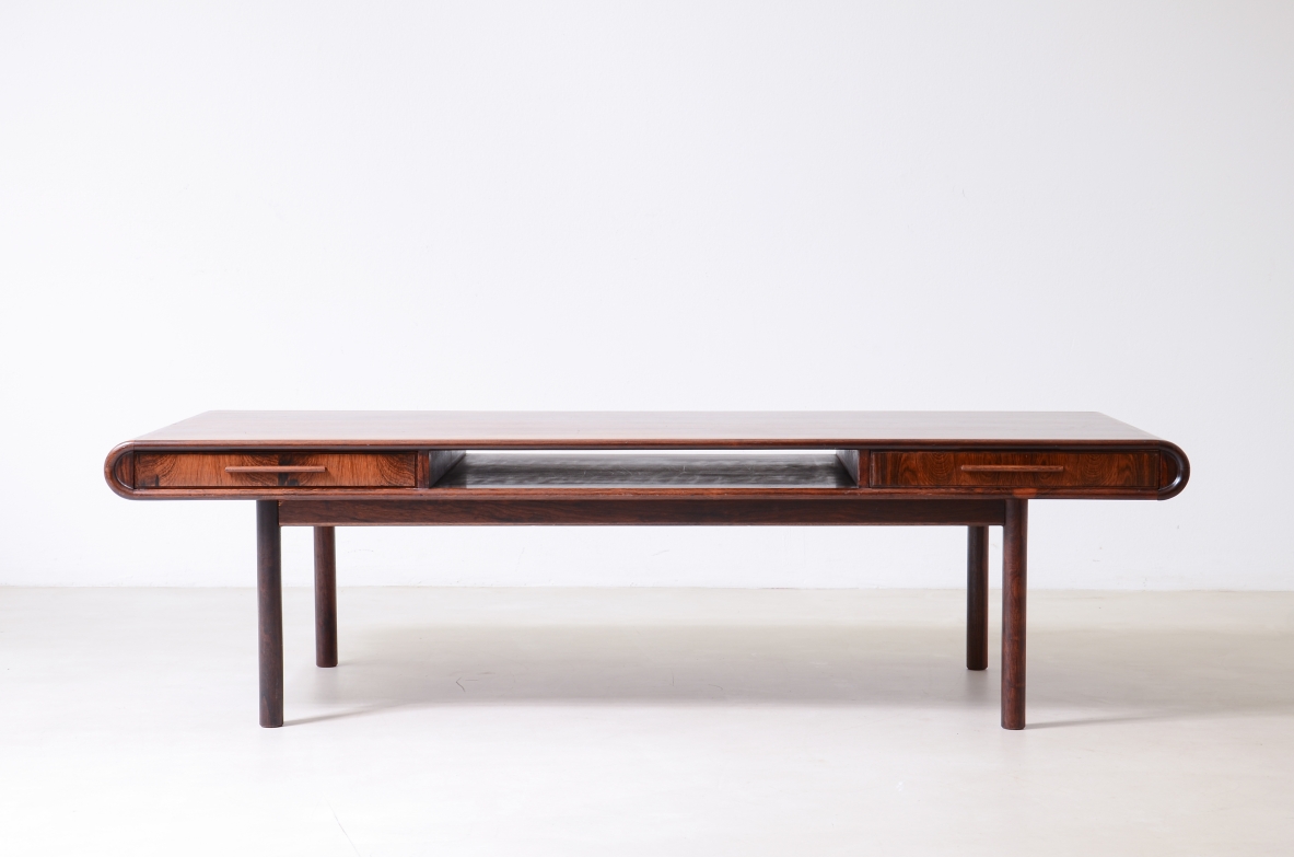 low table with two tops, an open compartment, and two drawers.Brazilian manufacture, ca. 1960.