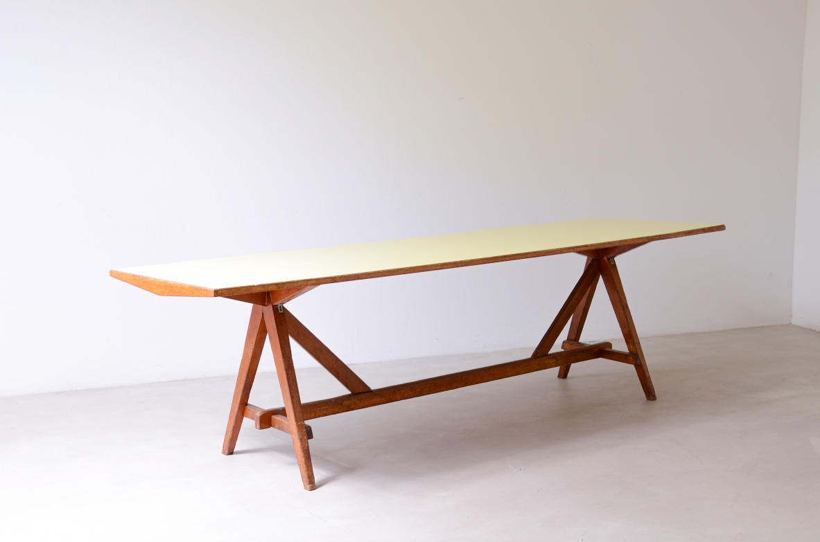Large oak table with a pastel yellow Formica top 1955