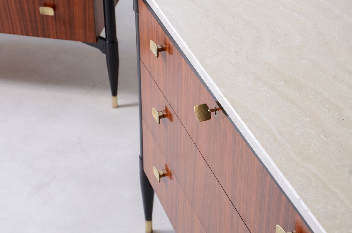 elegant walnut cabinets with travertine tops, three drawers with shaped brass handles. Italian manufacture, circa 1955.