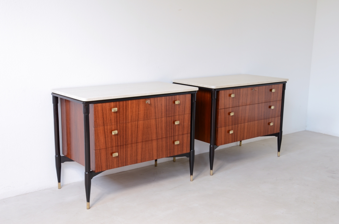elegant walnut cabinets with travertine tops, three drawers with shaped brass handles. Italian manufacture, circa 1955.