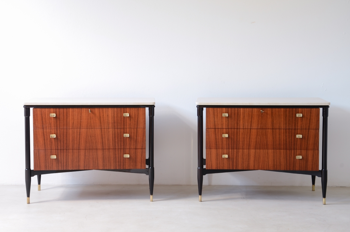 elegant walnut cabinets with travertine tops, three drawers with shaped brass handles. Italian manufacture, circa 1955.