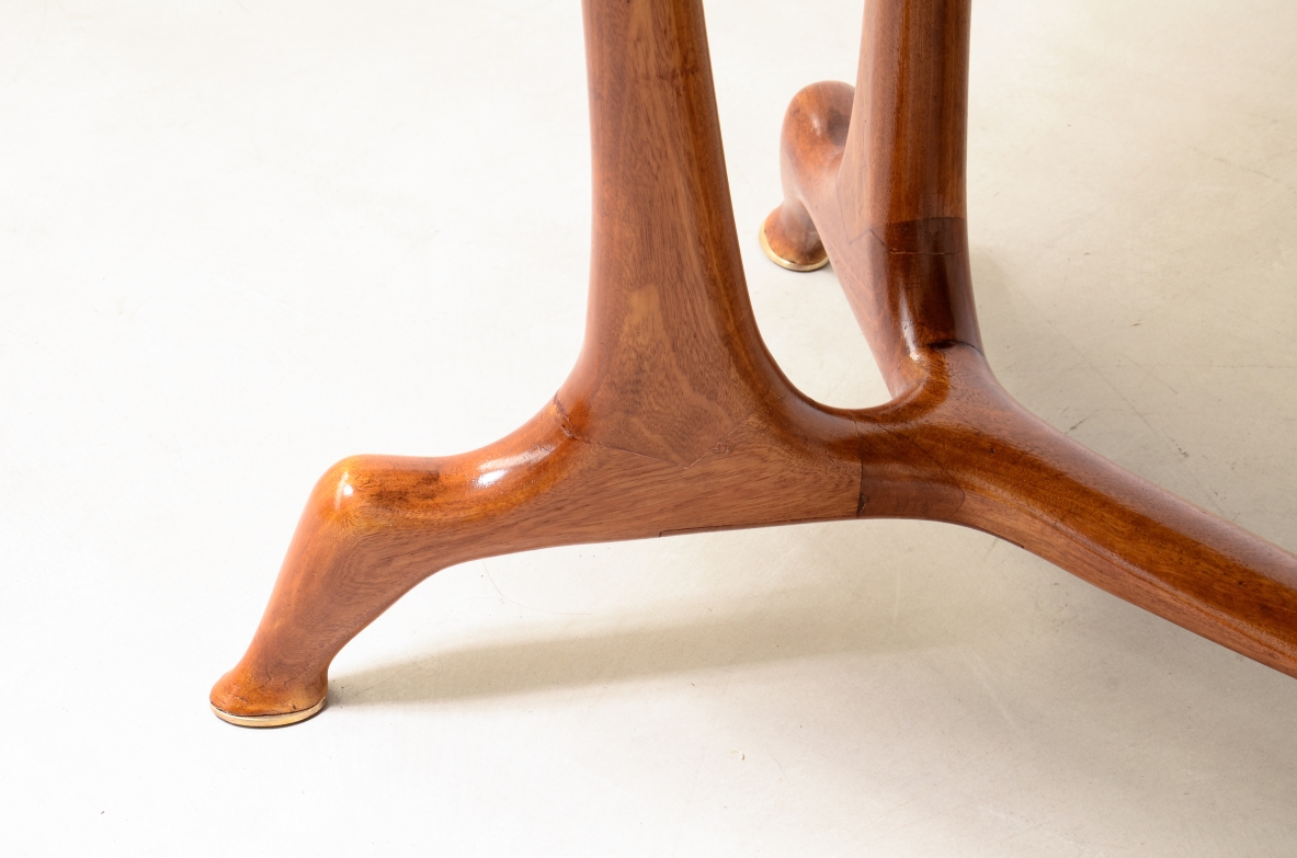 Unique cherry table with a sculptural base featuring taut lines, Made in Italy, circa 1950.