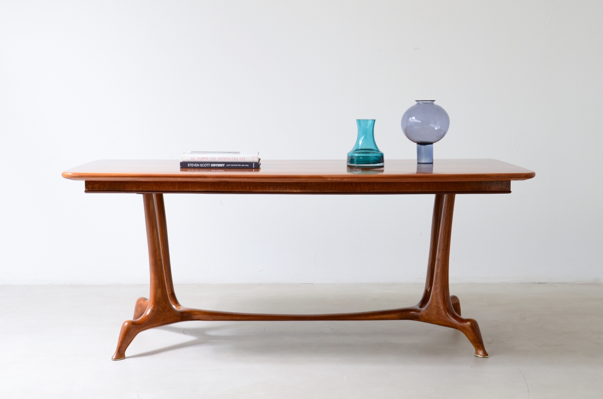 Unique cherry table with a sculptural base featuring taut lines, Made in Italy, circa 1950.