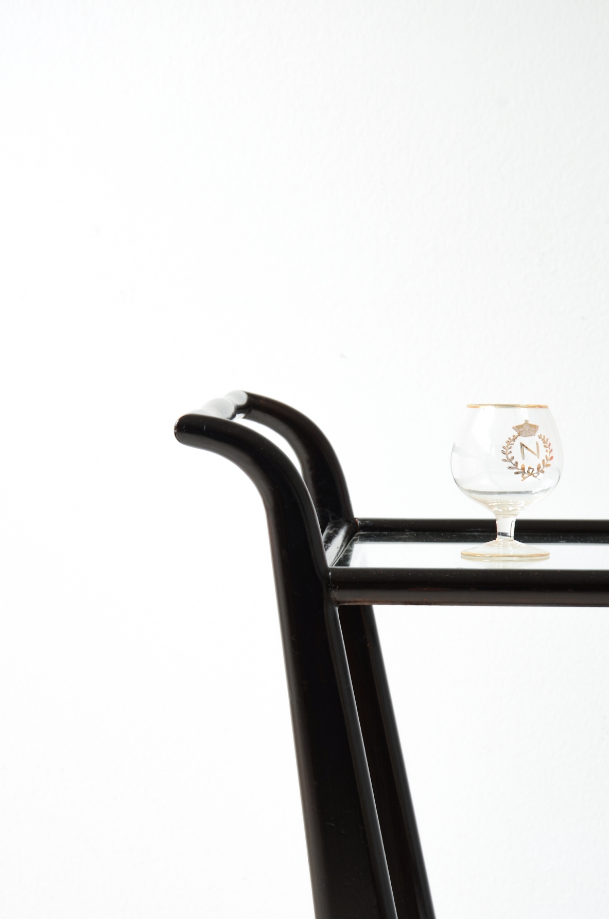 Stained wood serving trolley with two cut glass shelves.  Italian manufacture, ca. 1950.