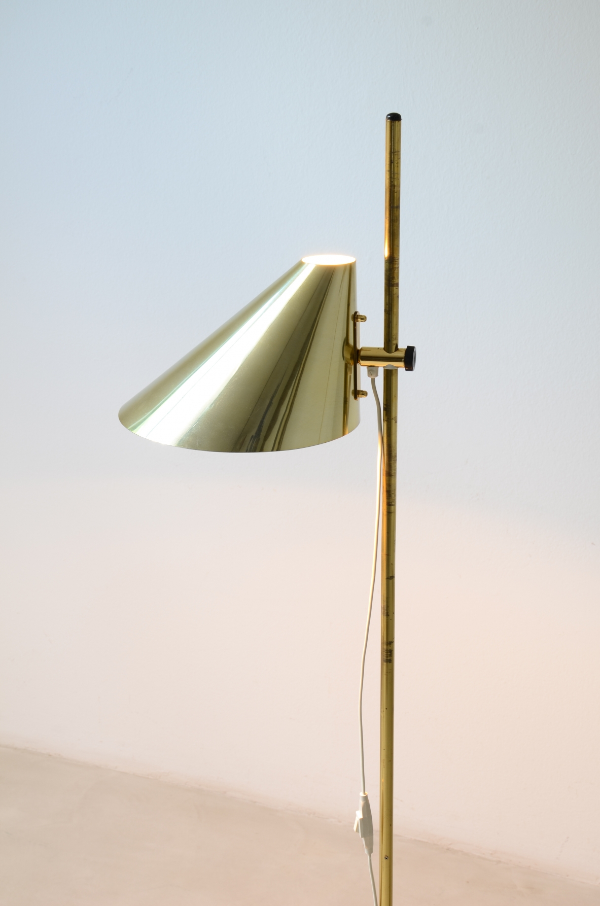 Hans-Agne Jakobsson. Two modernist brass floor lamps, Sweden, 1960.