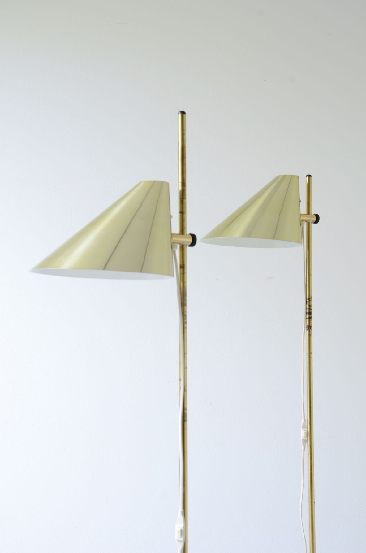 Hans-Agne Jakobsson. Two modernist brass floor lamps, Sweden, 1960.