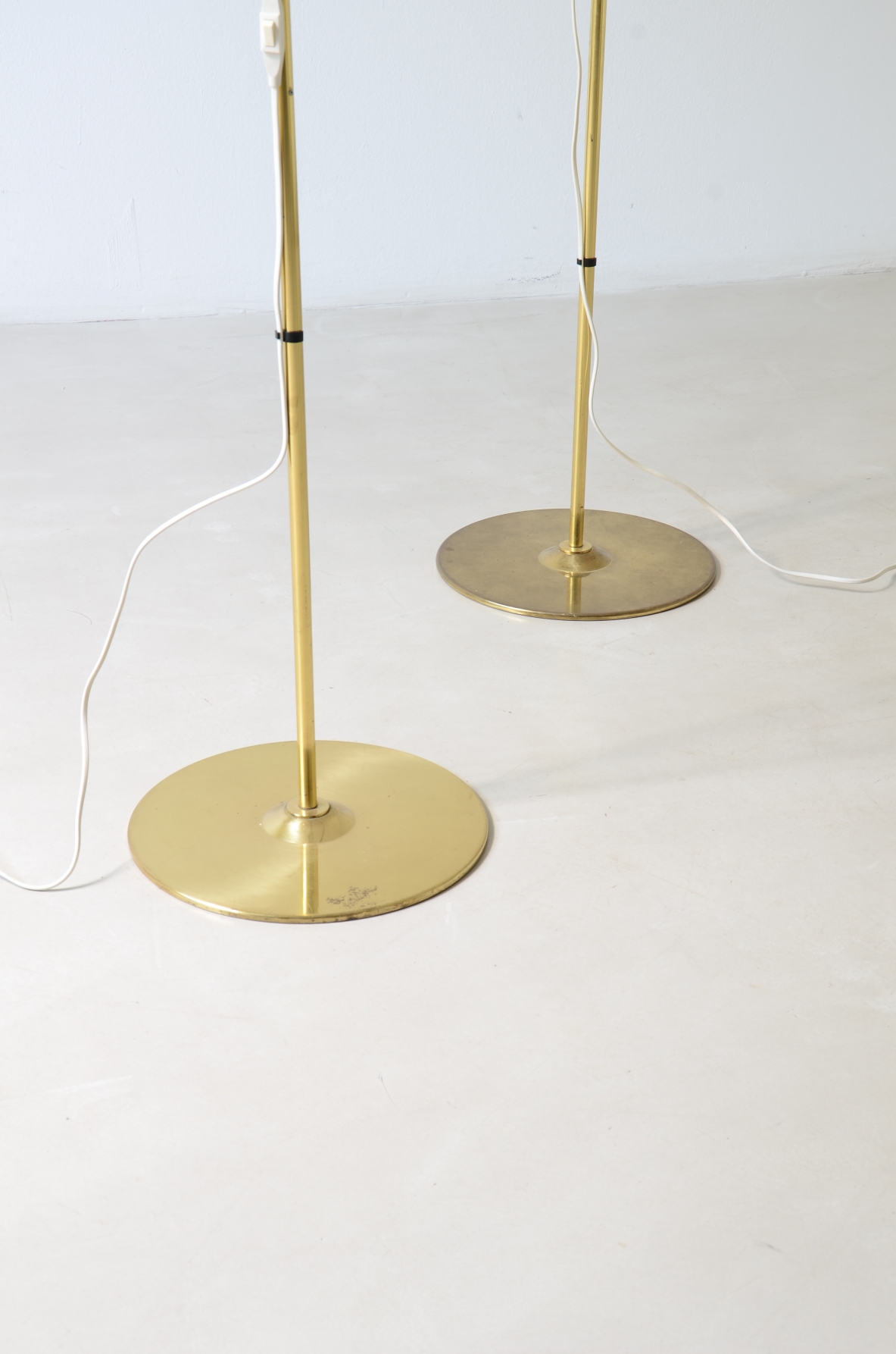 Hans-Agne Jakobsson. Two modernist brass floor lamps, Sweden, 1960.