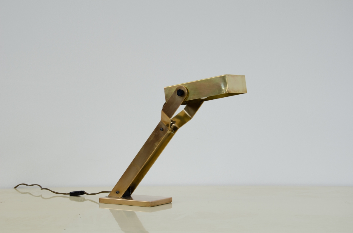 Italian 1960's table lamp in brass with adjustable shade.