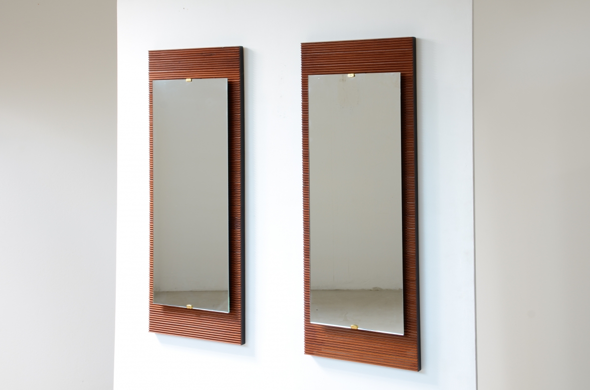 1950's Elegant pair of mirrors in reeded wood with ground mirror applied on ebonized wooden spacers
